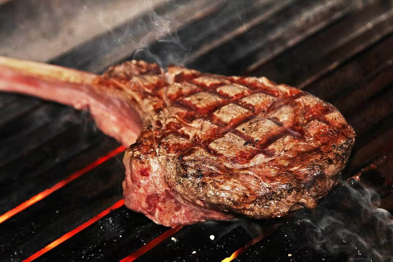 Charcoal grilled steak on a Firenace grill
